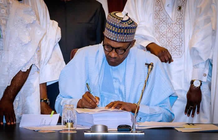 Signing of bill in UK: Nigerians attack Buhari